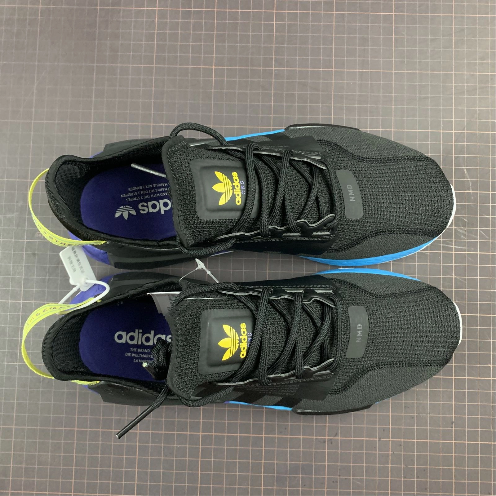 Adidas NMD R1 V2 Black Carbon Shock Yellow Toe box space