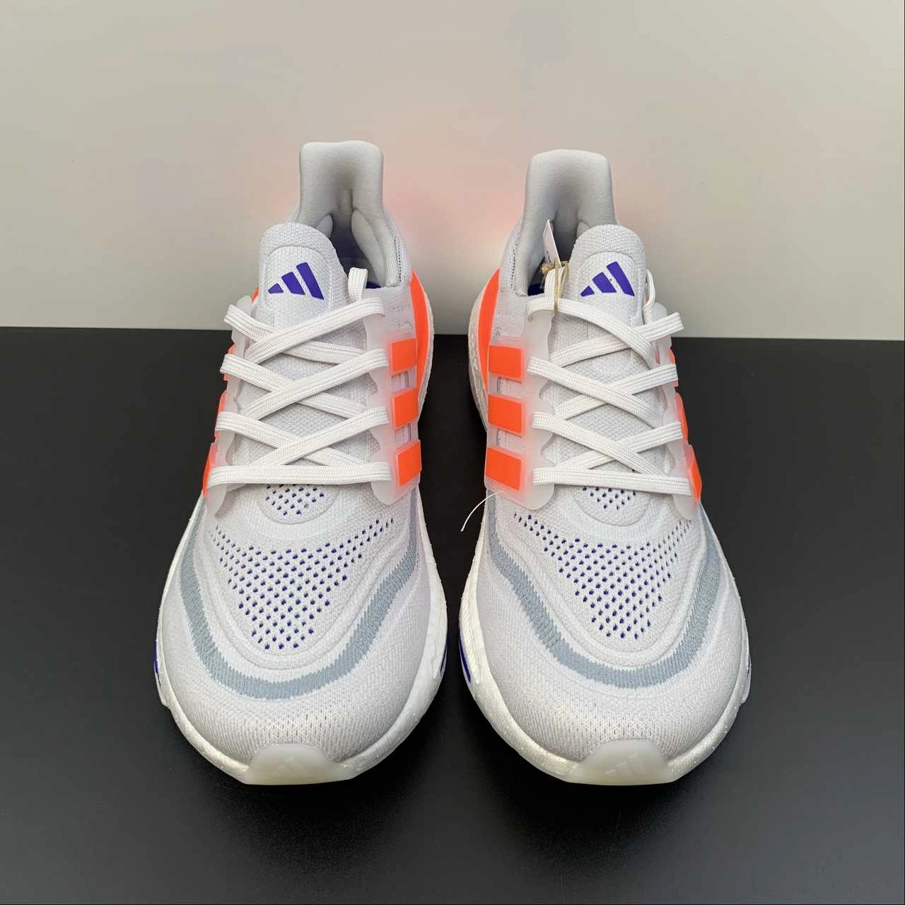 running in a cycling studio shoes UltraBoost Light Lime Orange Red Borland HQ6338