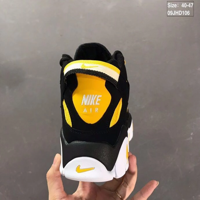 Air Barrage Mid QS Bright Yellow Black White CD9329-002 running in a boardwalk area shoes