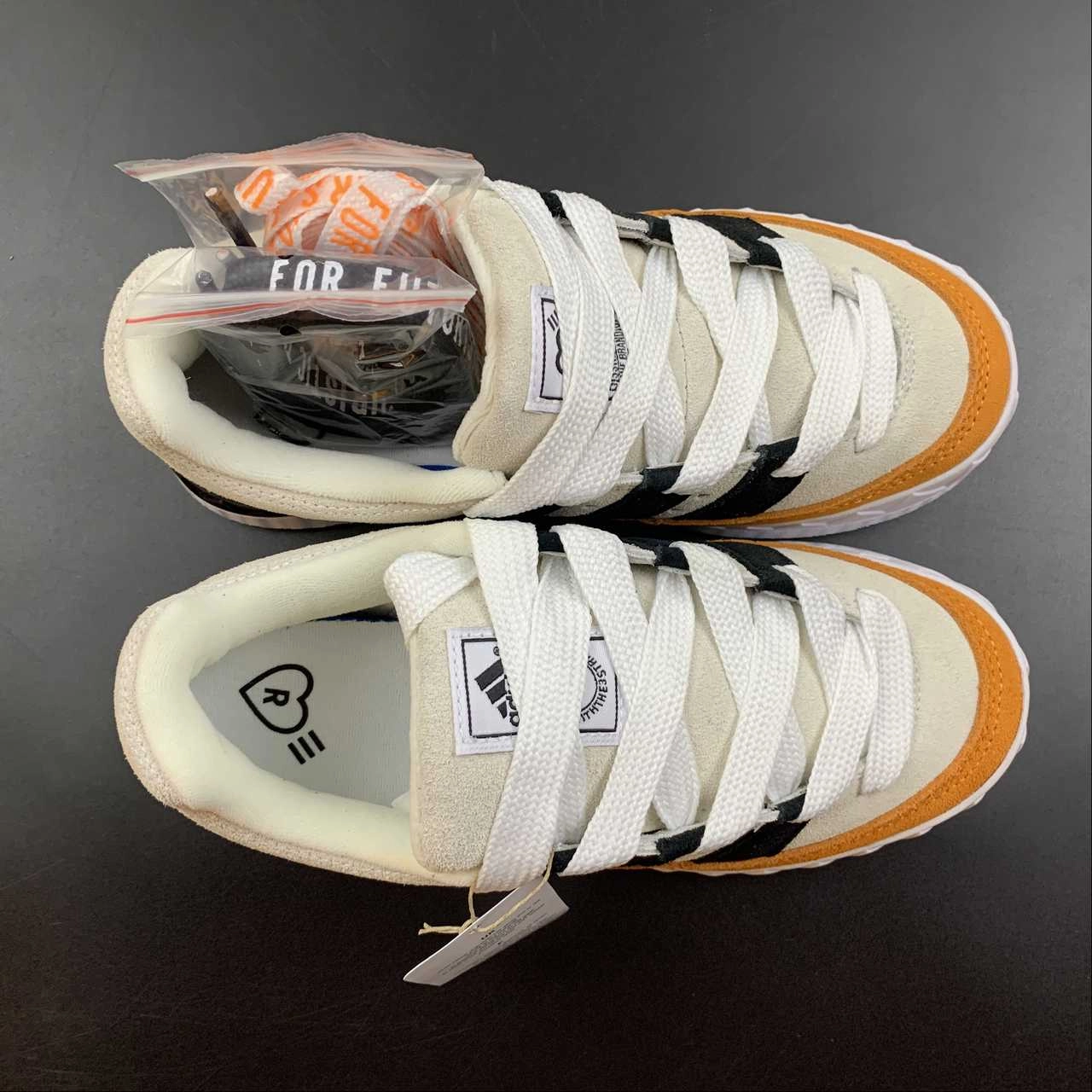 Adidas Adimatic HM Bright Orange HP9916 running in a train station area shoes