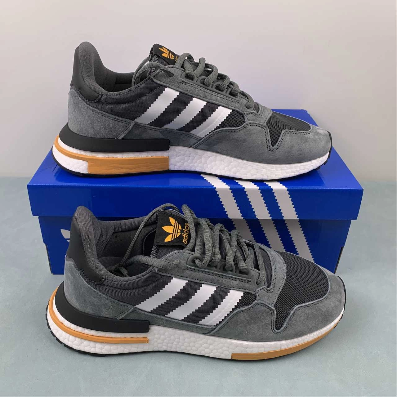 Adidas ZX 500 RM Grey Core Black Clear Orange B42388 running in a soccer field area shoes