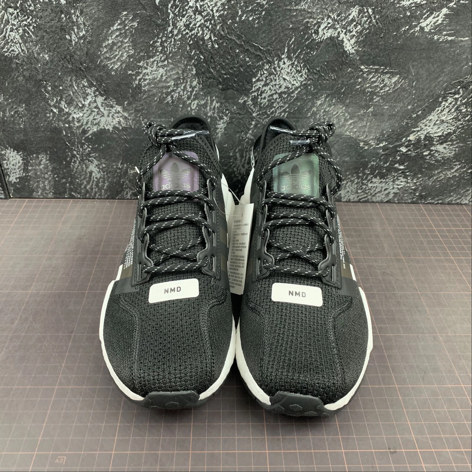 half - marathoning trendy - feature shoes Adidas NMD R1 V2 Black White