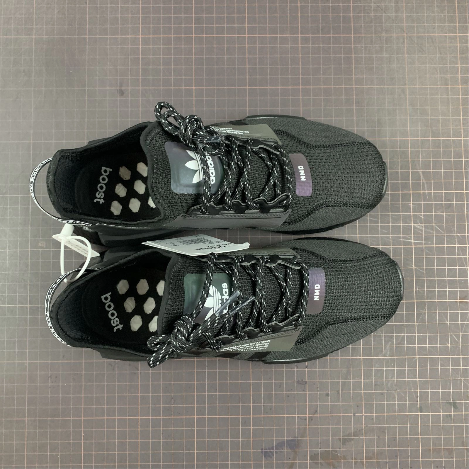 no - tie running shoes Adidas NMD R1 V2 Core Black Iridescent