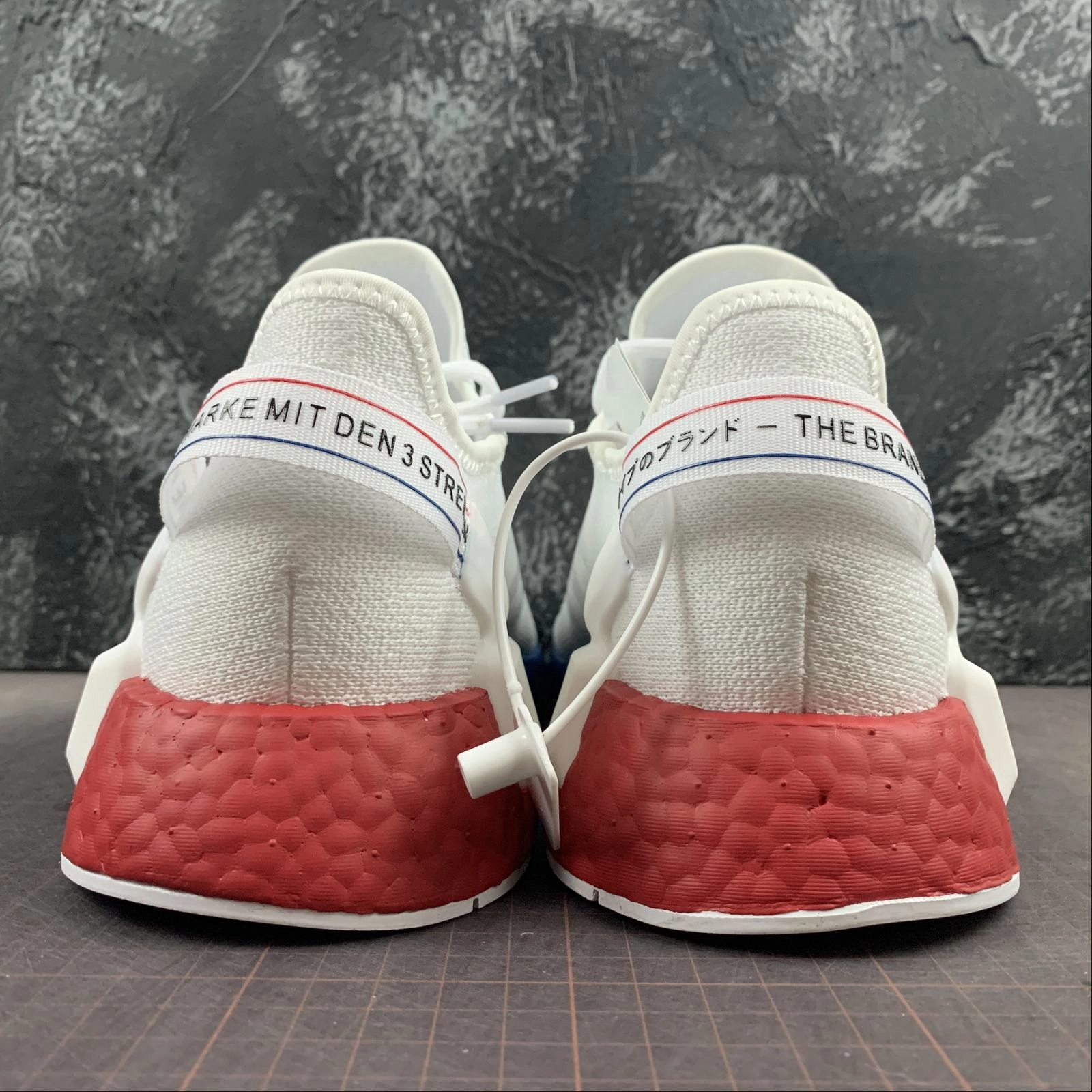 Adidas NMD R1 V2 White Blue-Red running in banked tracks shoes