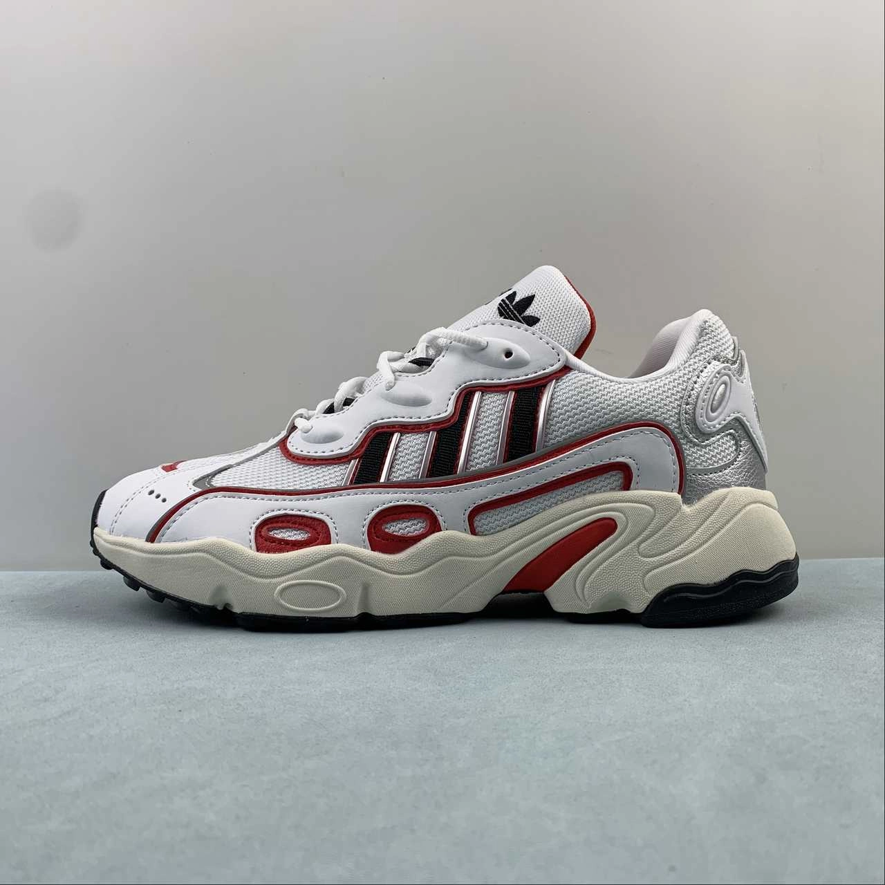 running in a floating bridge area shoes Adidas Ozweego OG W Cloud White Better Scarlet Silver Metallic IG6197