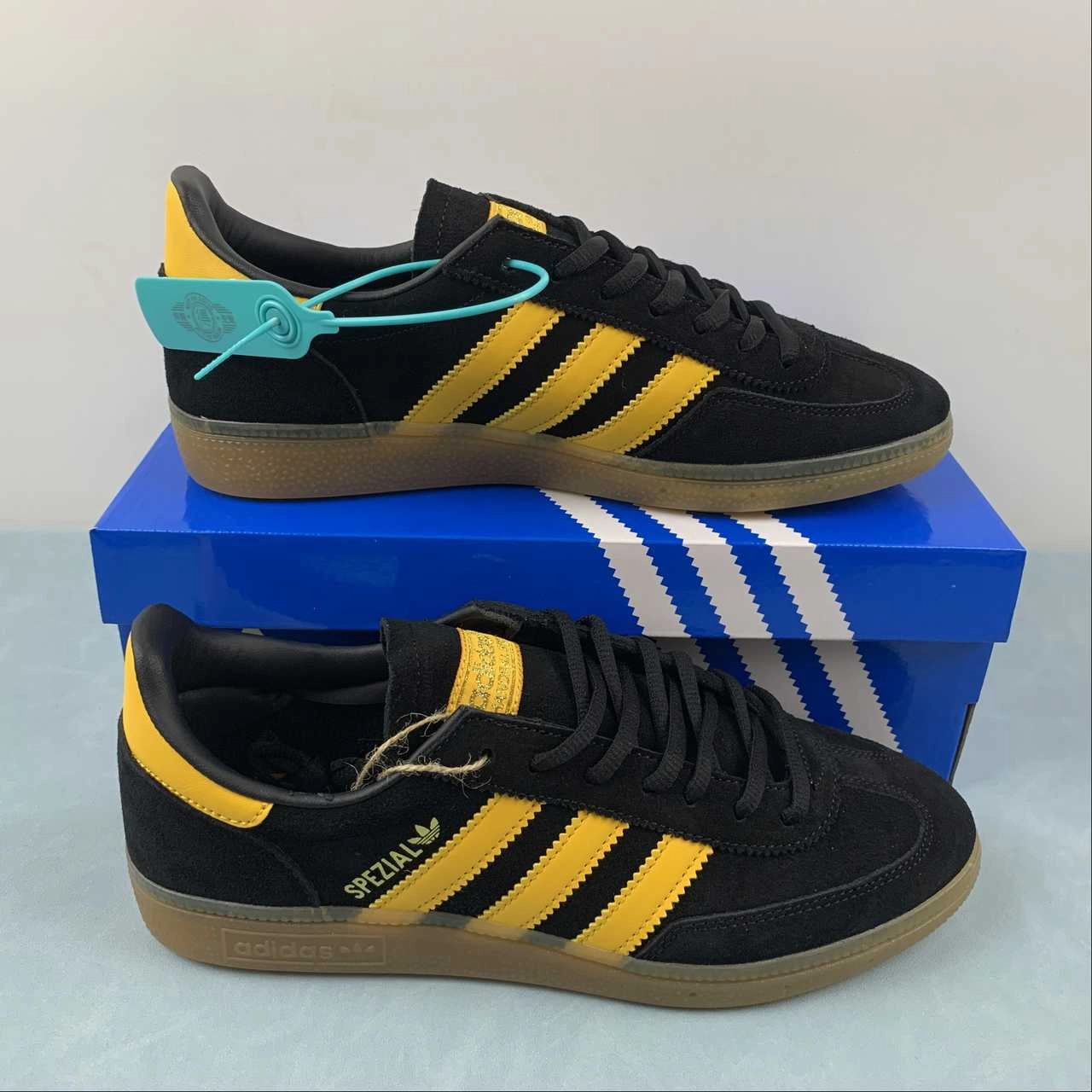 Adidas Handball Spezial Black Yellow FX5676 running on a clay track shoes