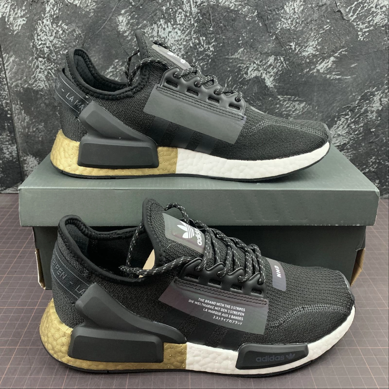 Adidas NMD R1 V2 Black Gold and White heel - cushion shoes