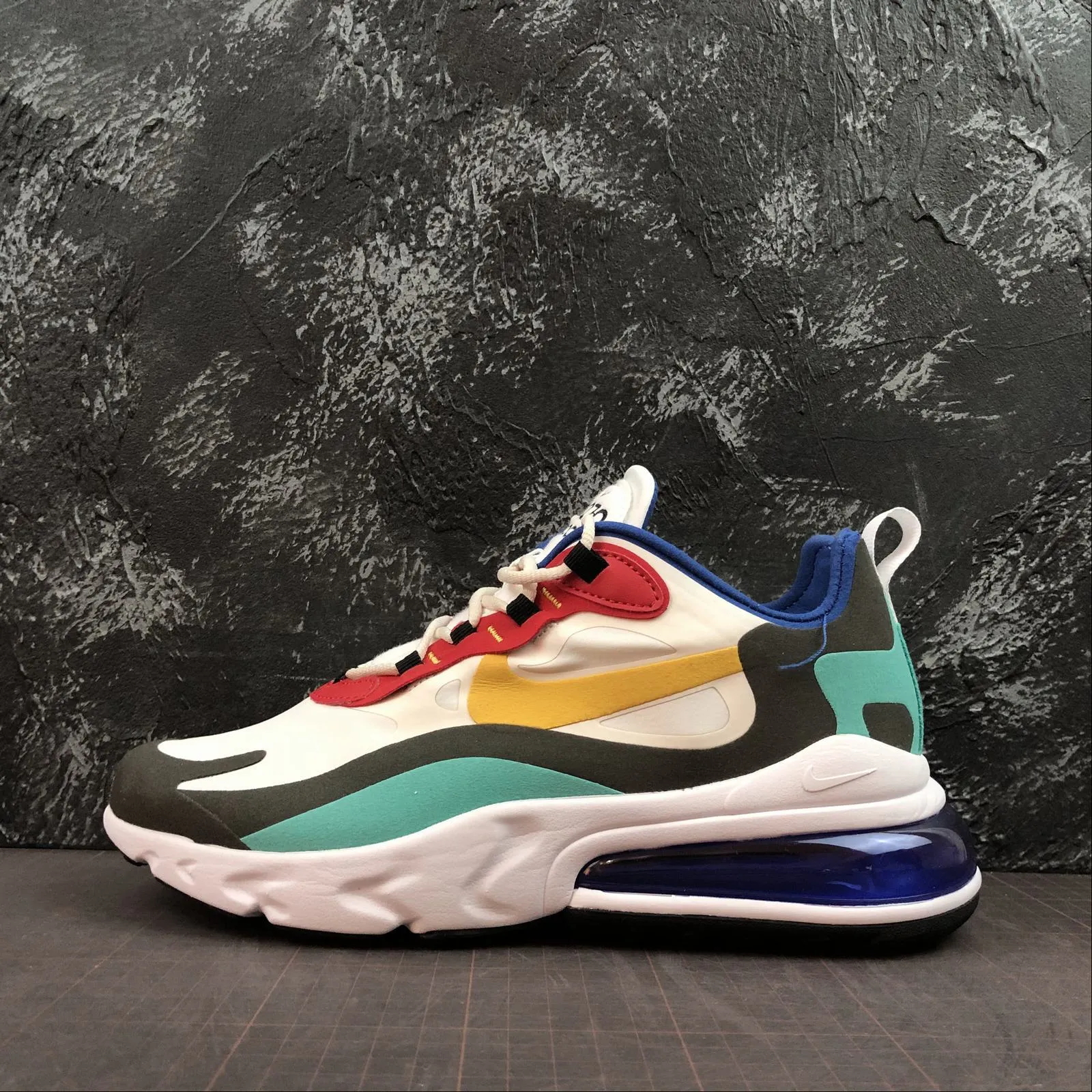 high - performance - feature shoes running in a nature reserve Air Max 270 React Phantom University Gold AO4971-002