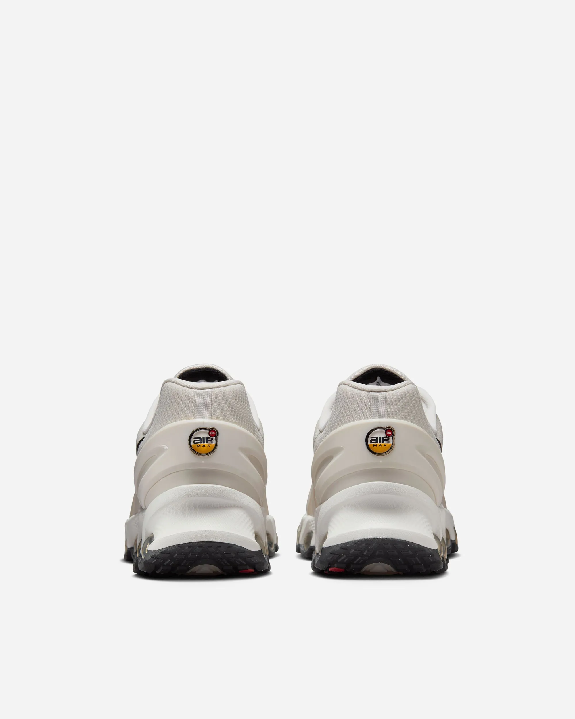 running in a suburban area shoes NIKE AIR MAX DN8