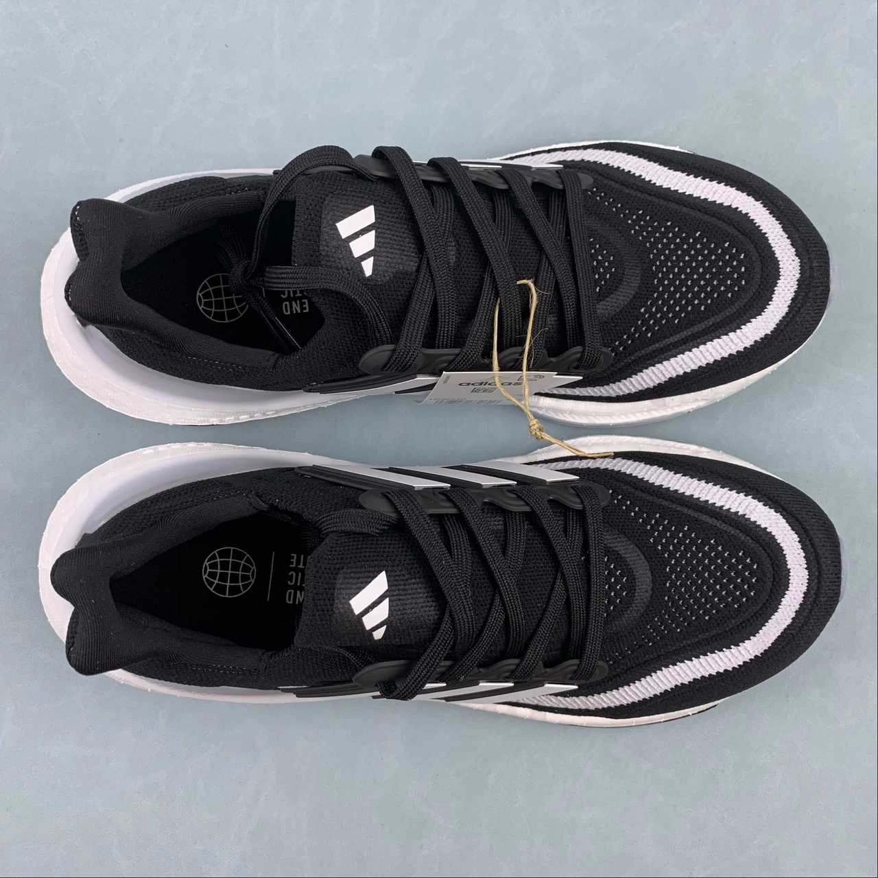 running in a dam area shoes Adidas UltraBoost Light Cloud White Core Black HQ6340