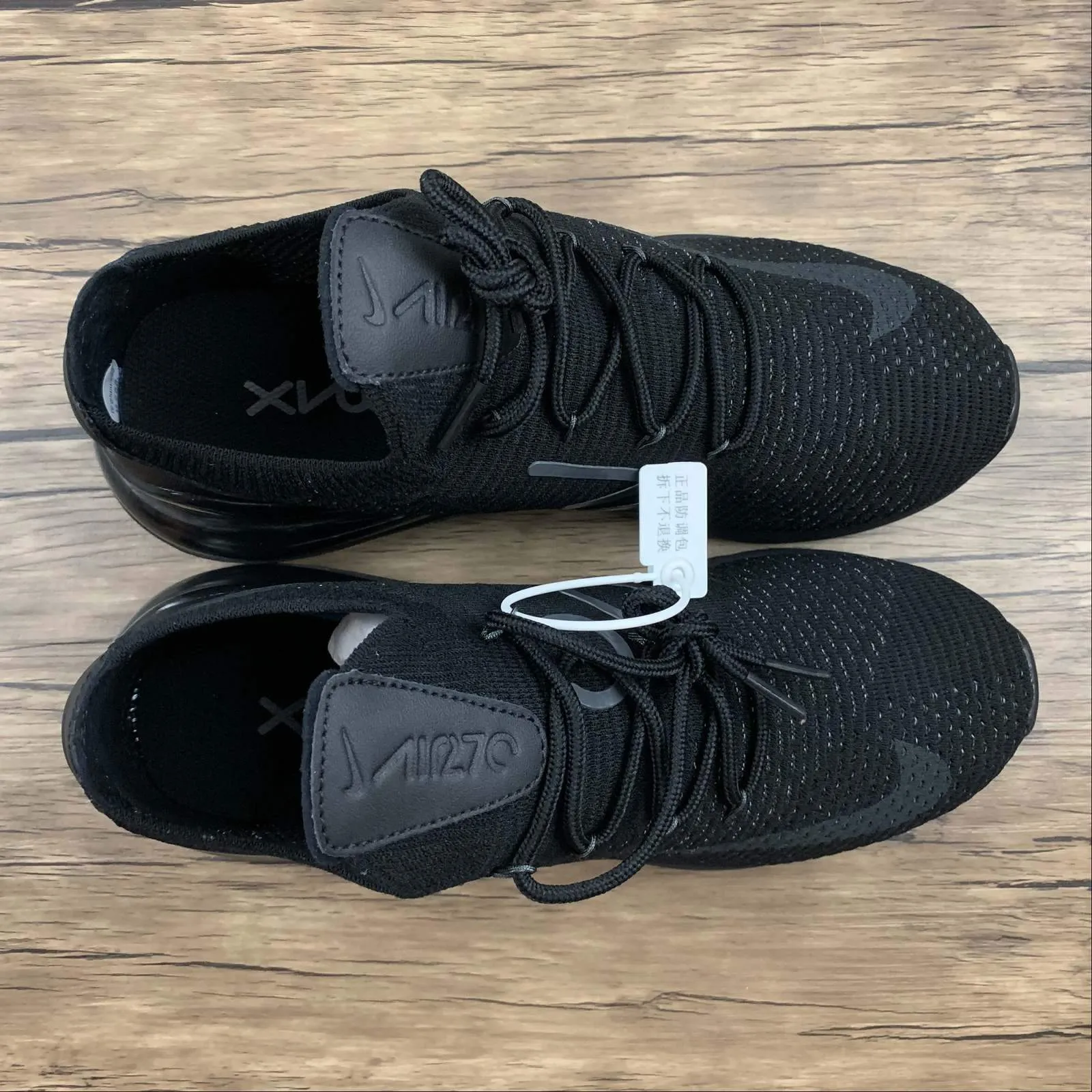 Air Max 270 FLYKNIT Black Anthracite-Black AO1023-005 running in a racecourse