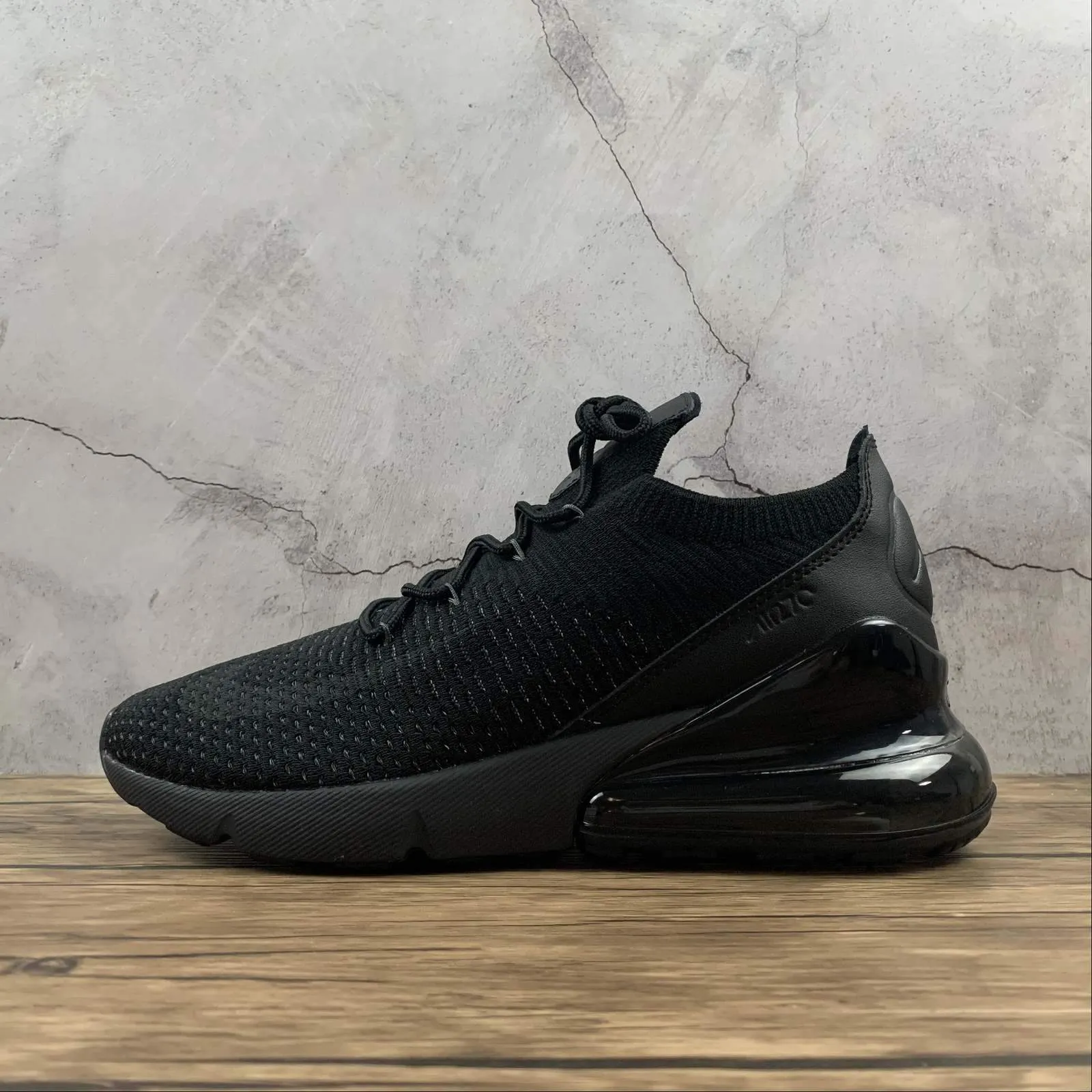 running on a treadmill at the gym shoes Air Max 270 FLYKNIT Black Anthracite-Black AO1023-005