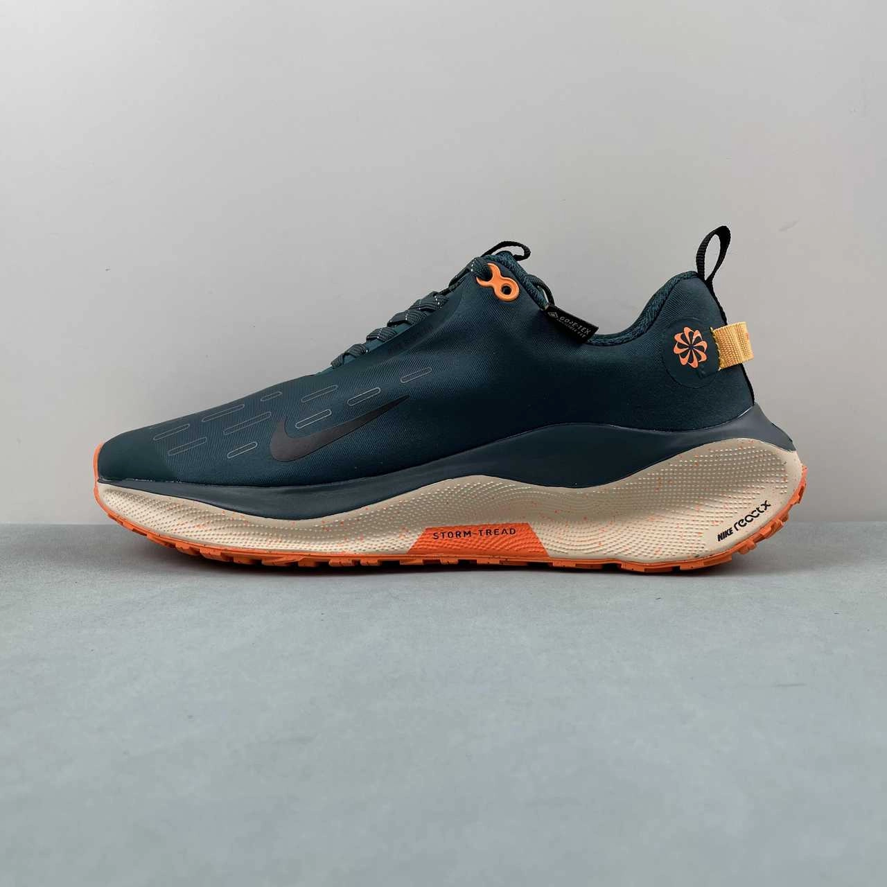 waterproof running shoes running on a synthetic track shoes Nike ReactX Infinity Run 4 Gore-Tex Deep Jungle Geode Teal Total Orange FB2204-300