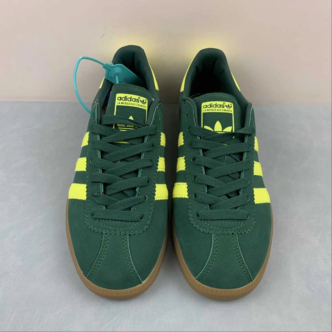 Adidas Bermuda Collegiate Green Shock Yellow Gum B41472 running with a flexible outsole