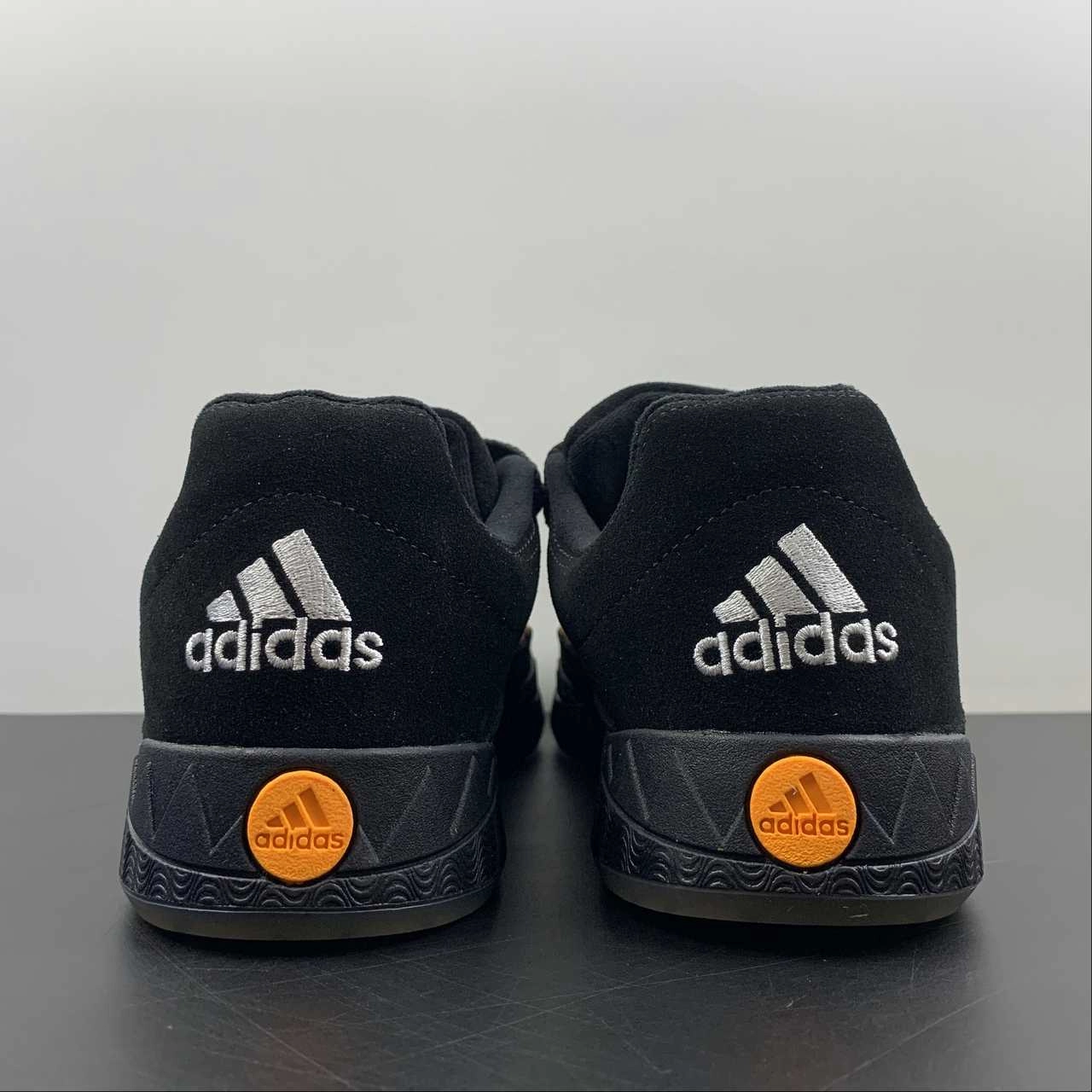 Adidas Adimatic Jamal Smith Black Orange Rush GX8976 running on flats