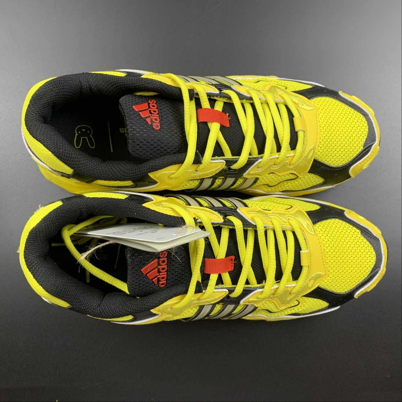 Adidas Response CL x Bad Bunny Yellow running on a track oval running in a ditch area shoes