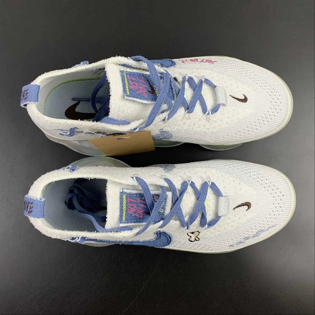 Air Max Scorpion FK Just Do It White Blue Whisper FJ7736-141 running with a gum rubber outsole