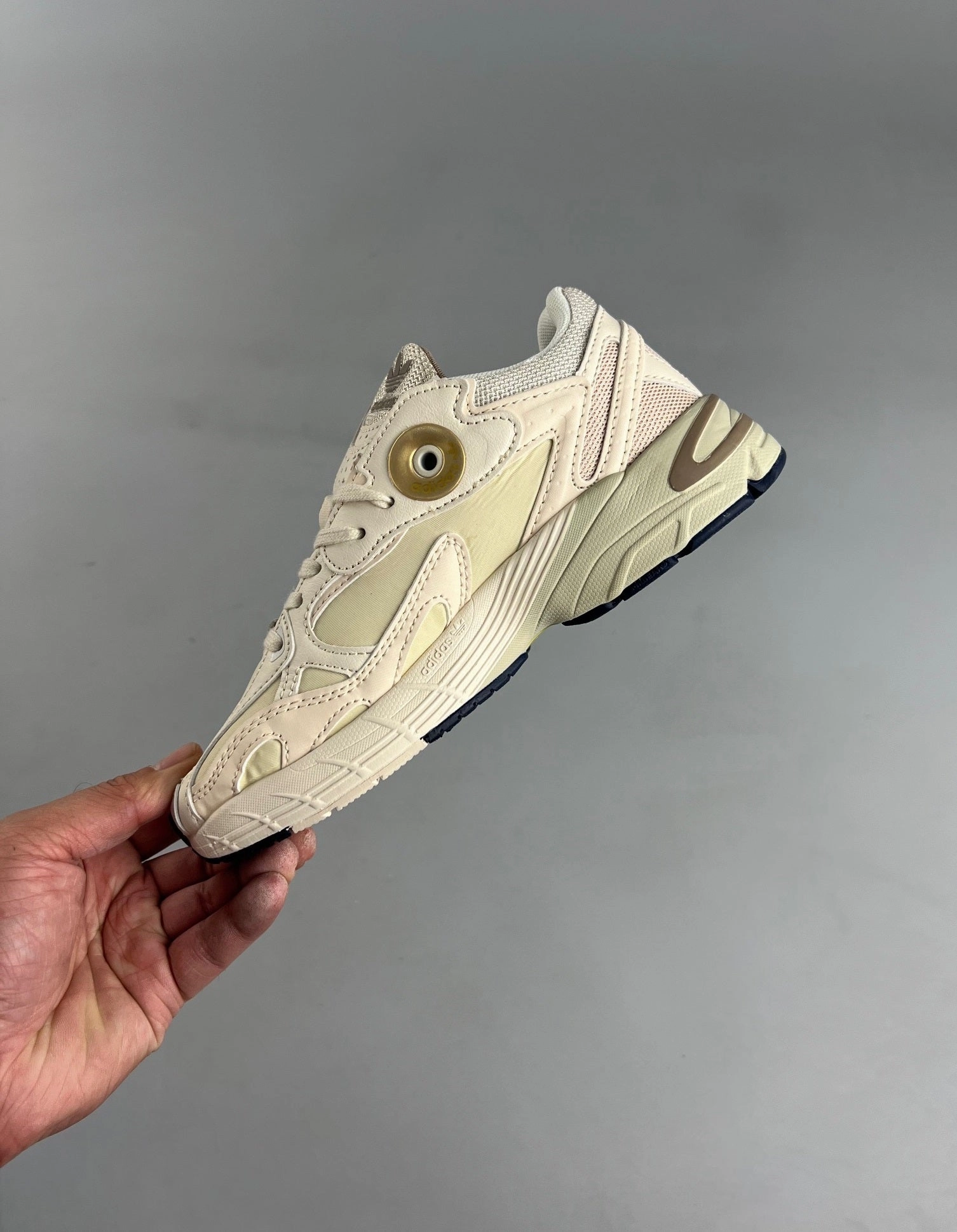 Adidas Astir ??EcruTint?? Gold Metallic GX7046 running in wet tracks shoes