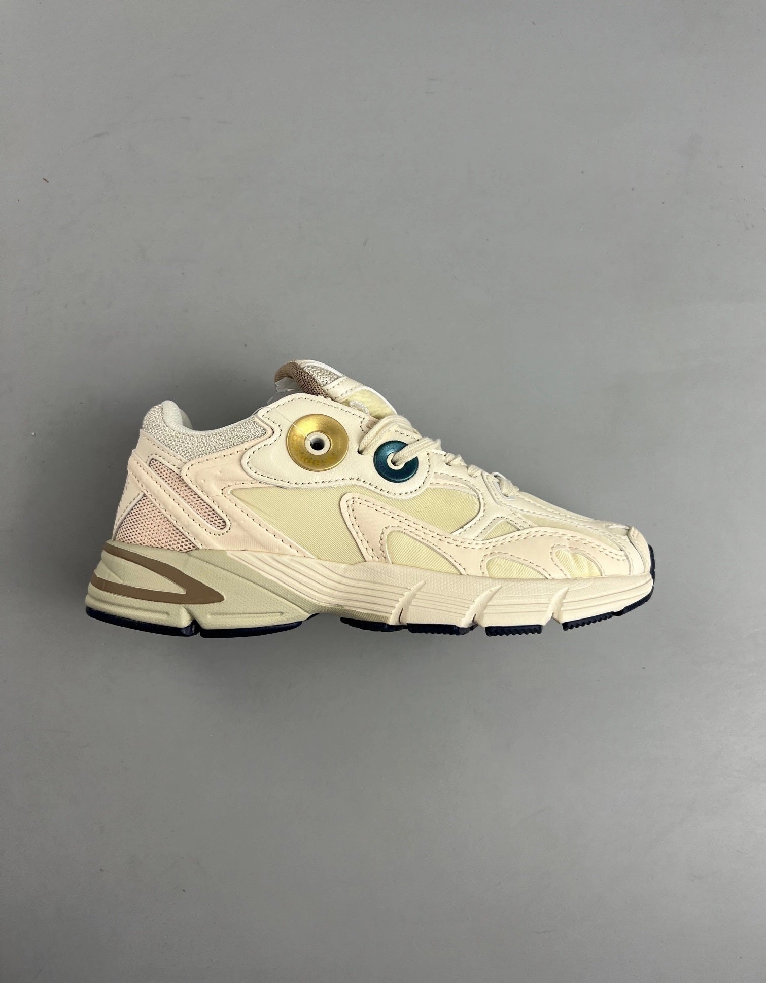 Slim - fit treadmill running footwear Adidas Astir ??EcruTint?? Gold Metallic GX7046