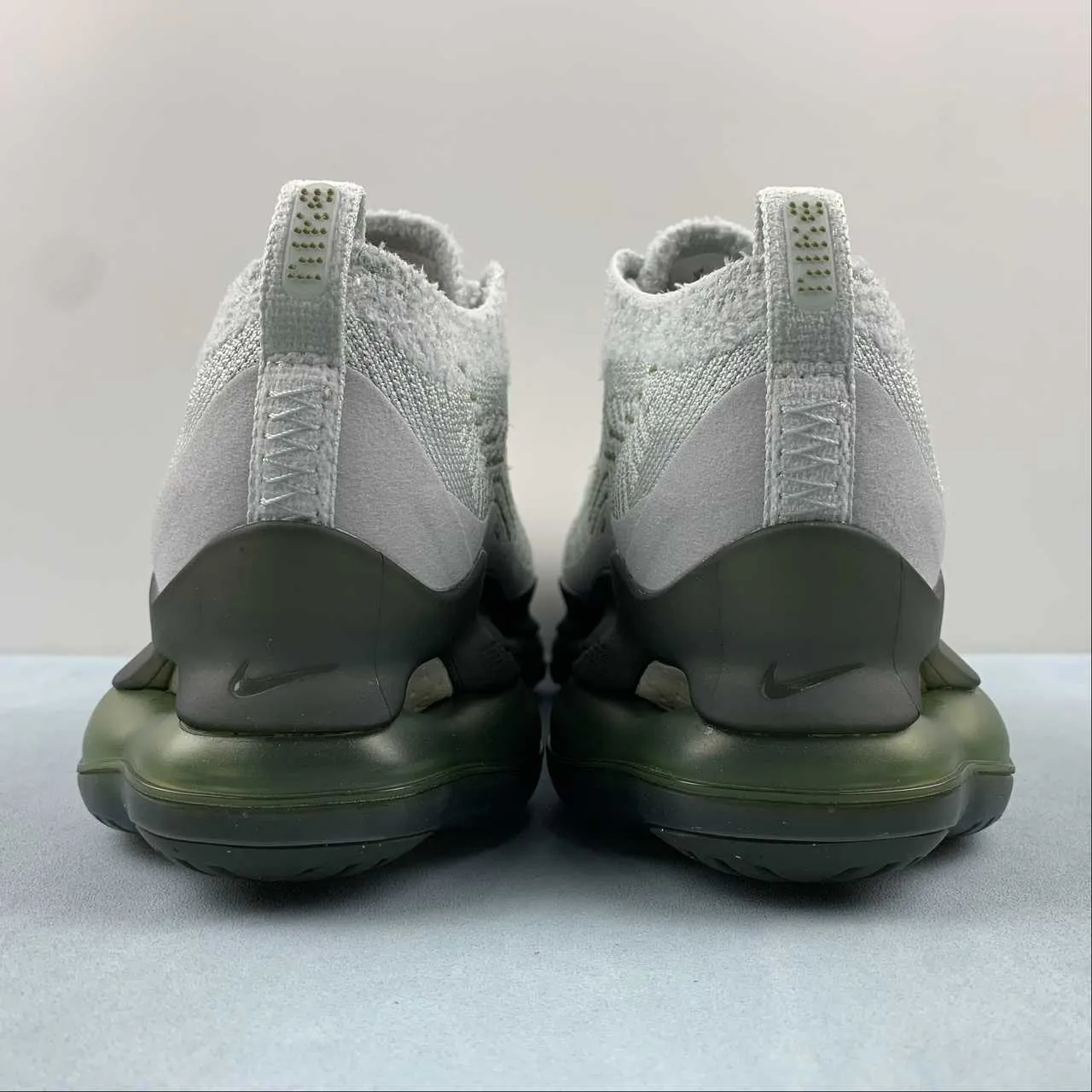 Air Max Scorpion FK Purple Gray Black DJ4701-005 running in an obstacle course race grassy track running shoes