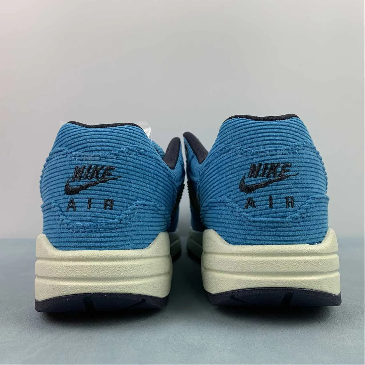 Air Max 1 Corduroy Baltic Blue Sesame Gridiron Sail FB8915-400 running with a sports bra Traction Grip