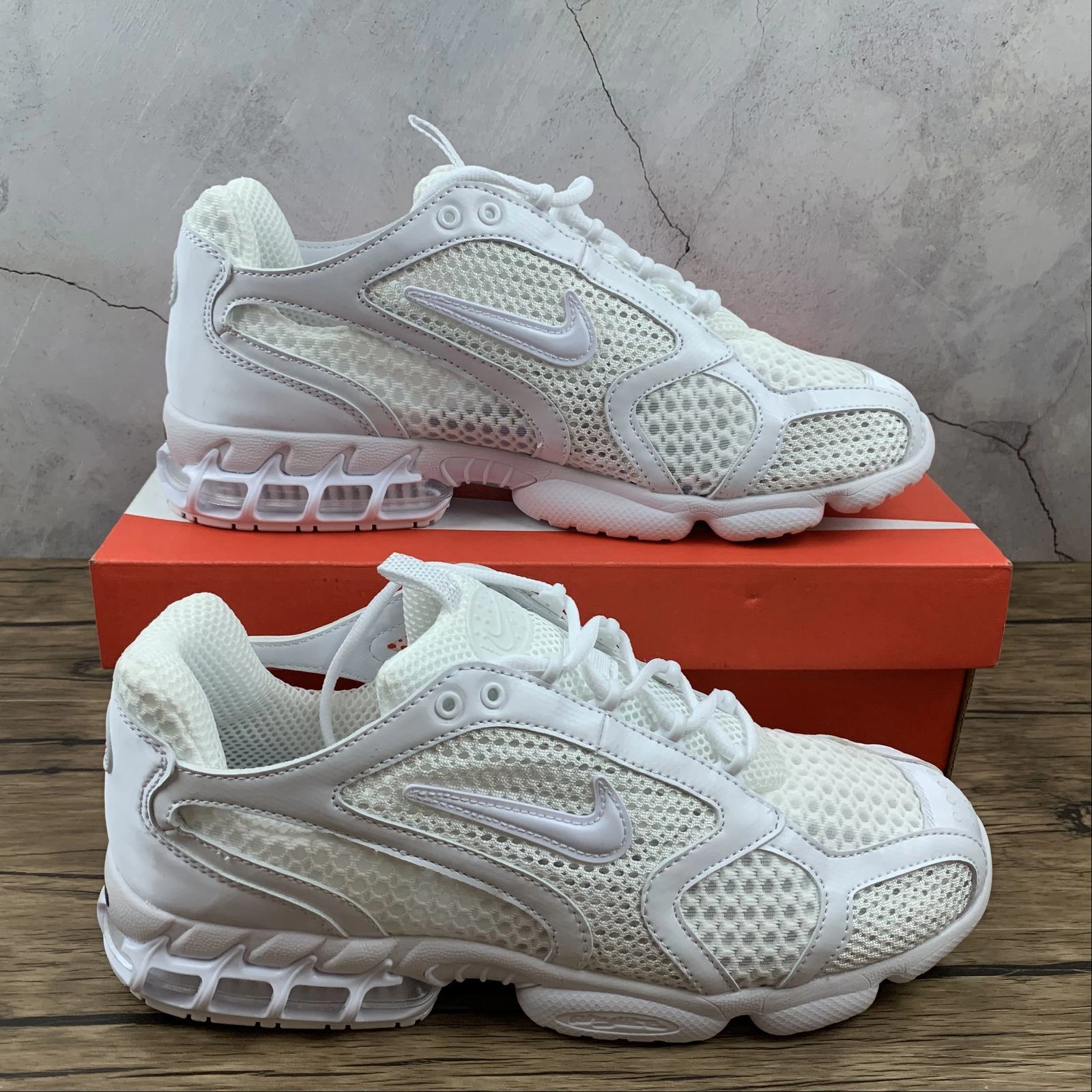 Air Zm Spiridon Cg 2 Stussy All White CJ1288-100 running with a headlamp running in a softball field area shoes