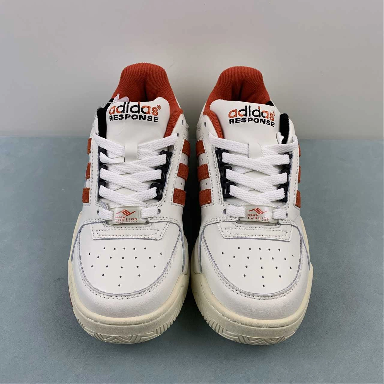 running in a nature reserve Adidas Torsion Response Low Cloud White Preloved Red Cream White HQ8787