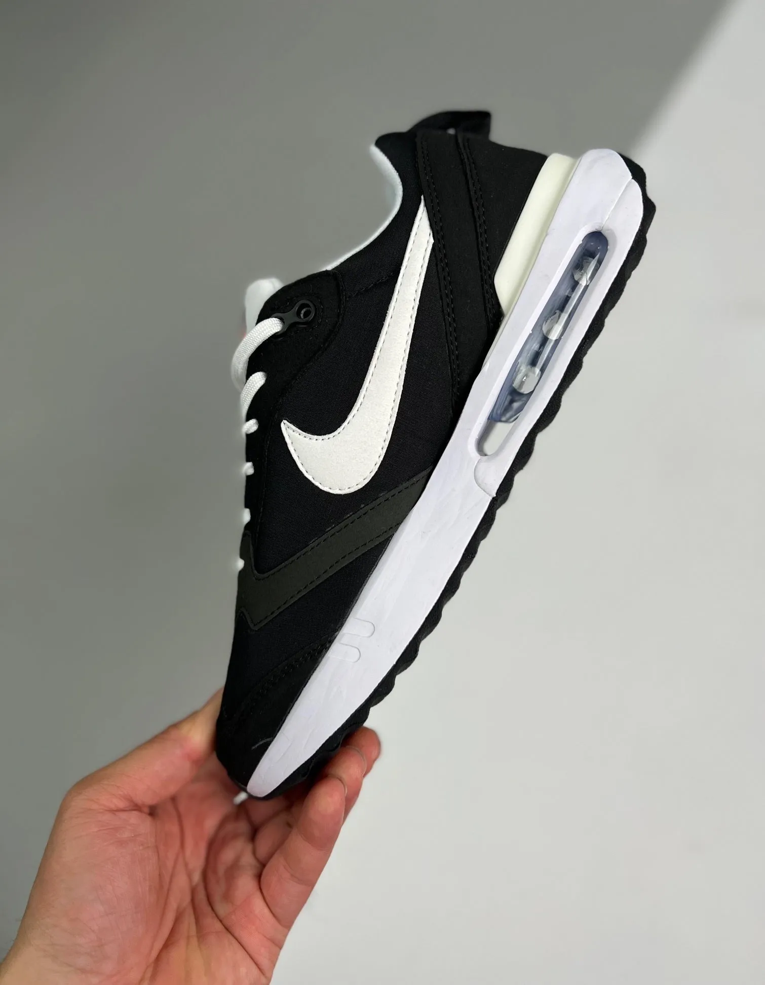 Air Max Dawn Metallic Black Silver Total Orange Summit White DJ3624-001 running with a slip - on design