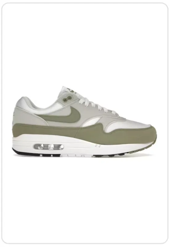 Nike Air Max 1 Light Army Green running in a light rail station area shoes premium - running
