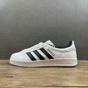 Adidas x Gucci Gazelle White Black running in a roundabout area shoes