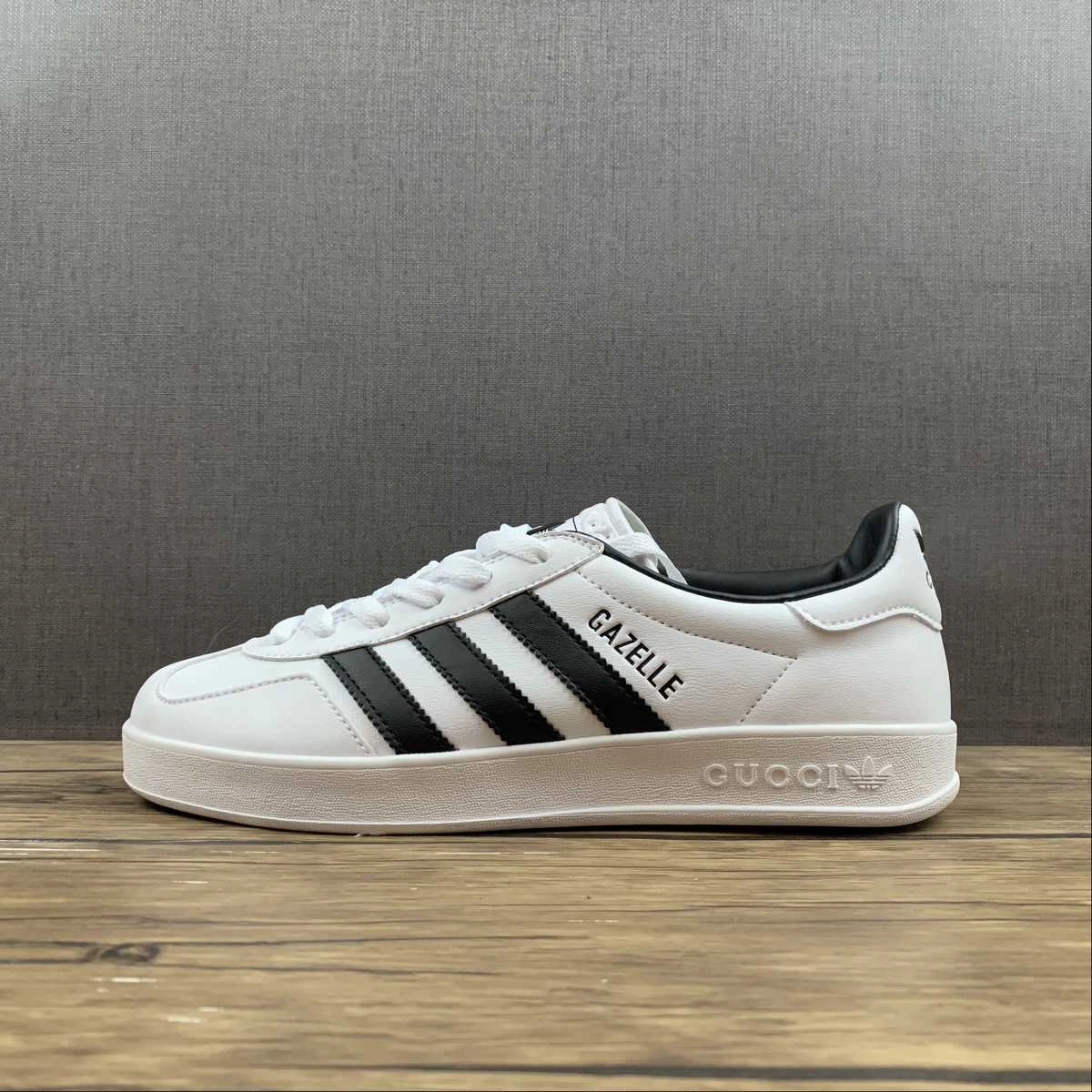 Adidas x Gucci Gazelle White Black running in a roundabout area shoes